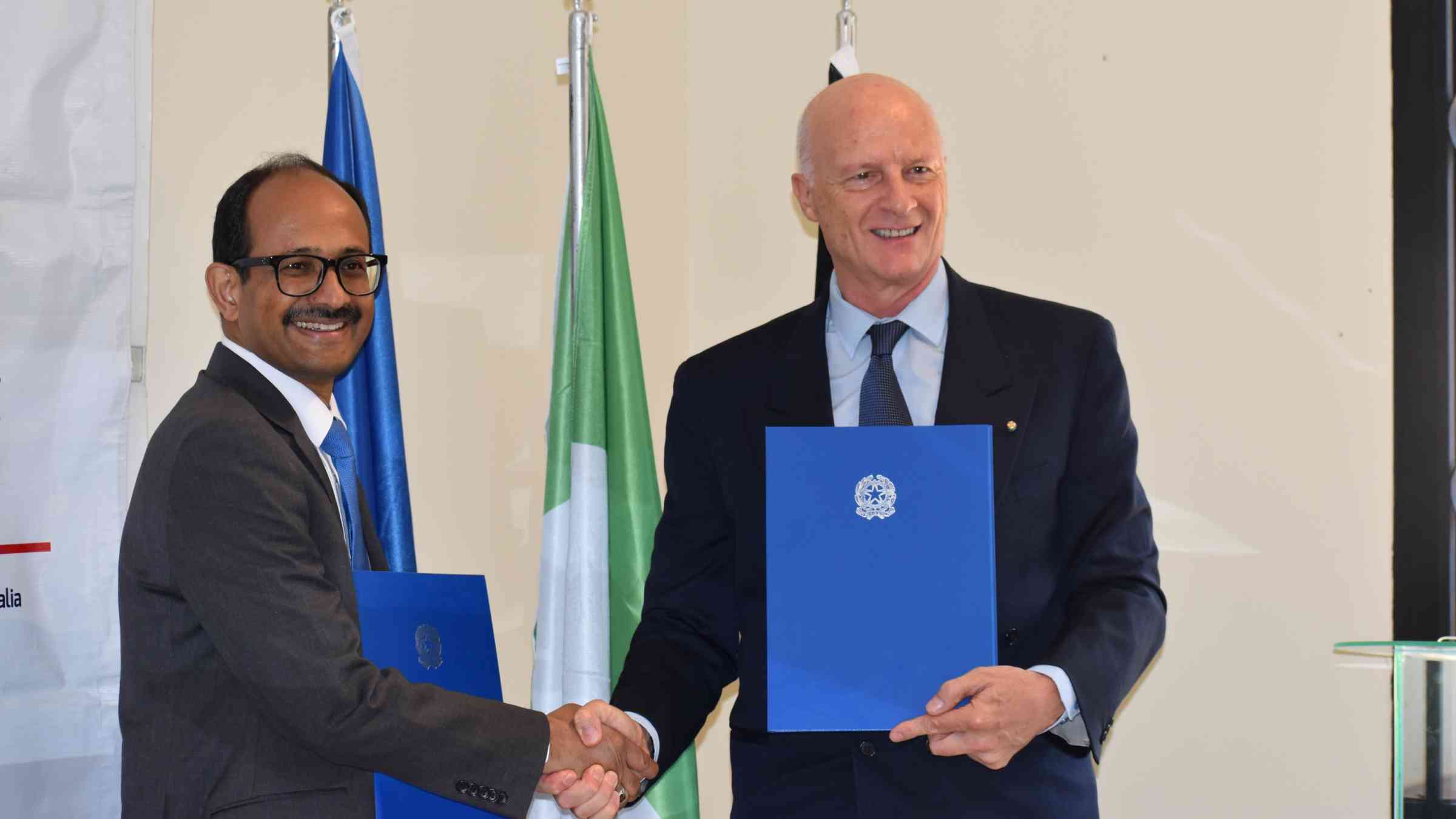 SRSG UNDRR and Italy ambassador to Kenya shaking hands