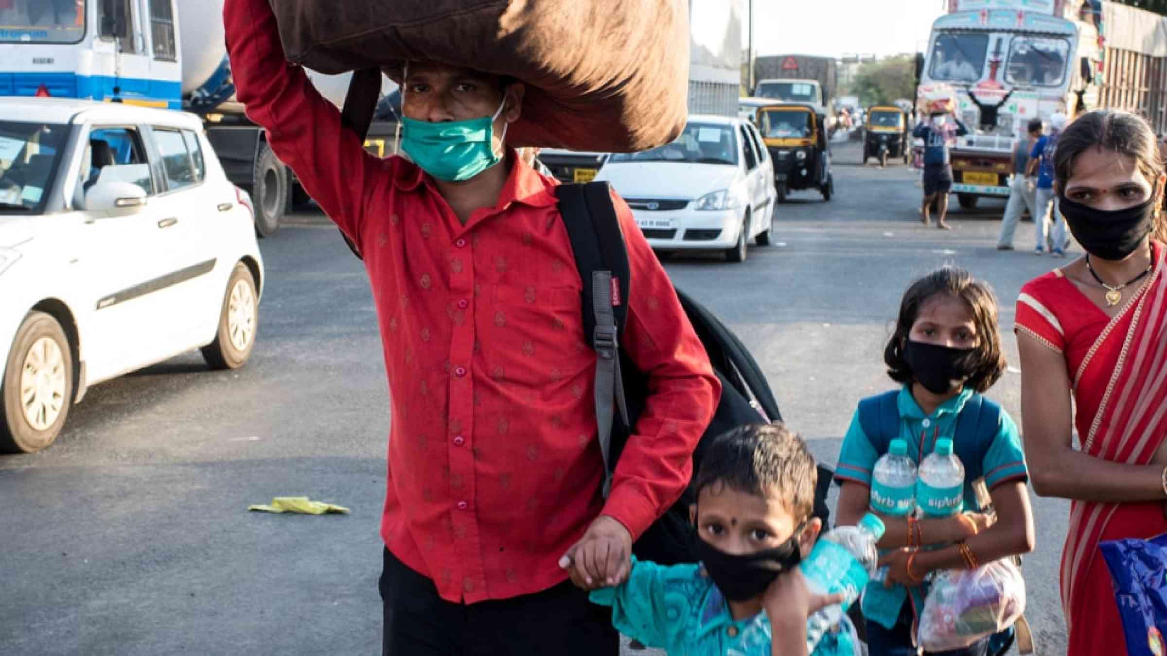 Migrant workers on their way back home in India