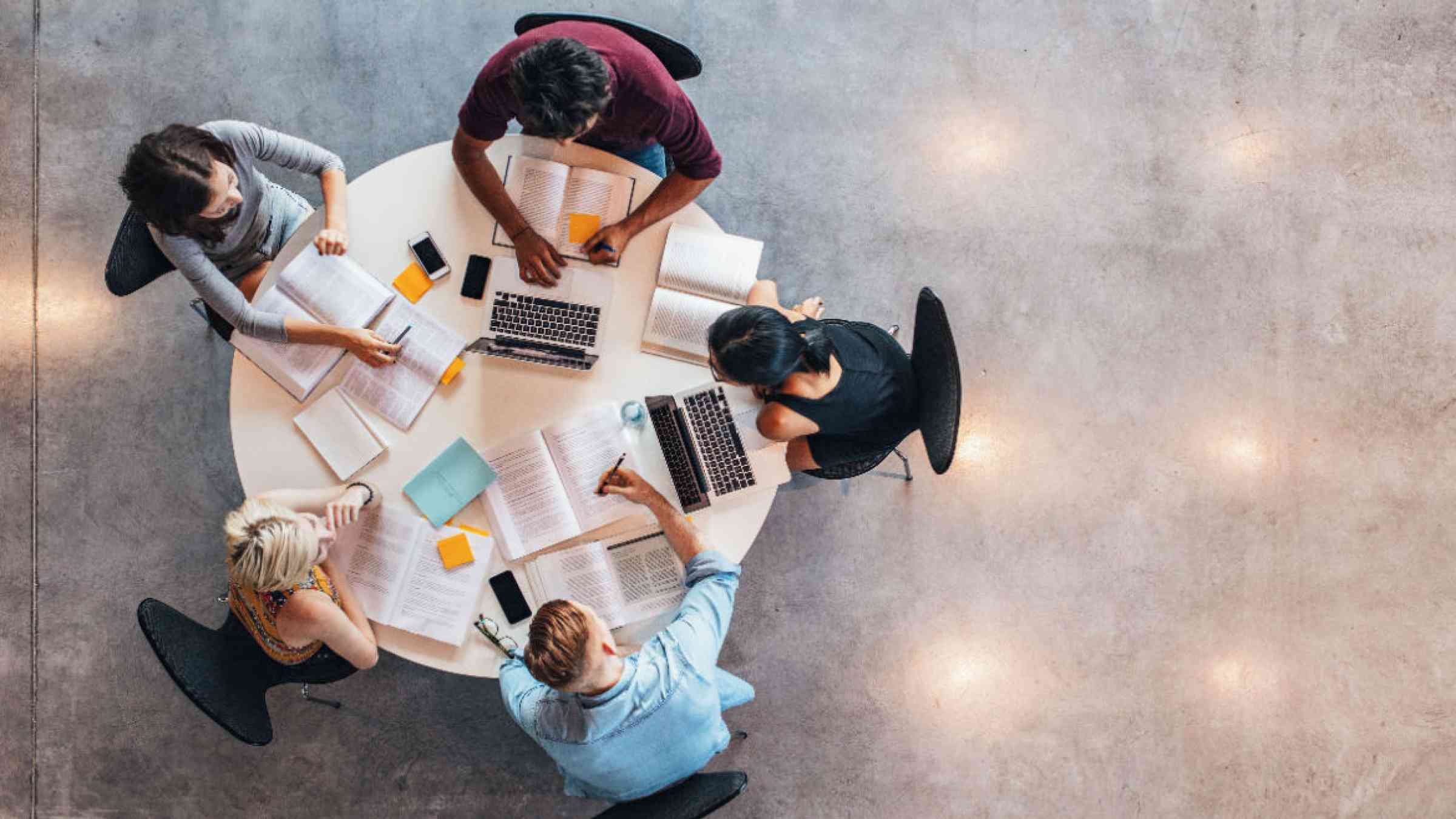 View from above of a round table where students sit at